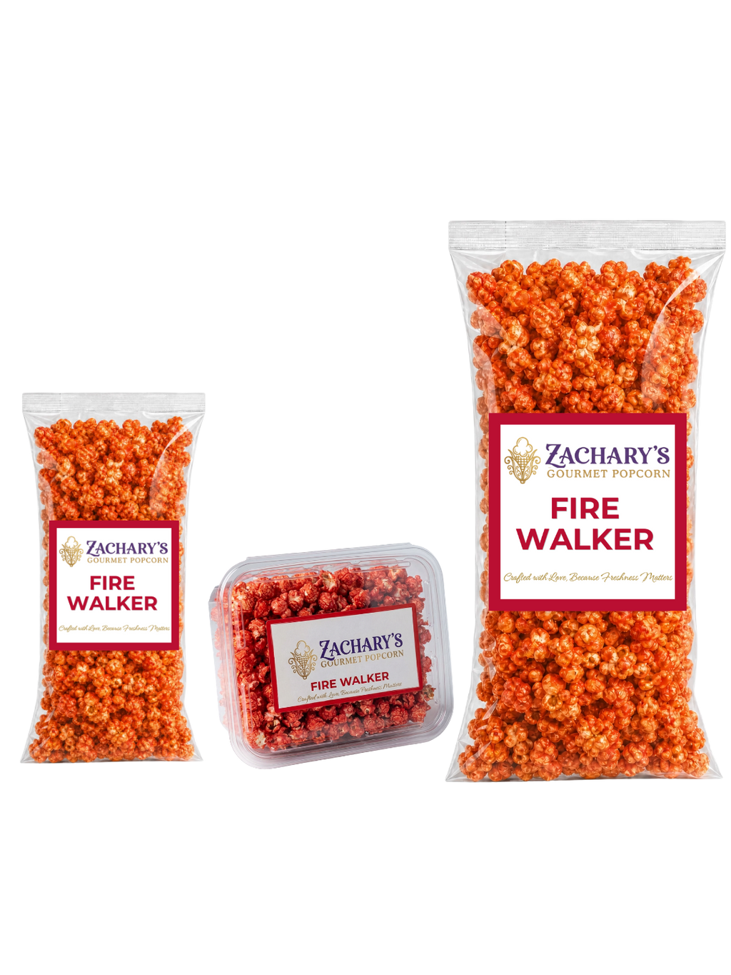 Three sizes of Zachary's Fire Walker gourmet popcorn — shareable bag, clear tub, and large party-size bag — orange spicy-coated kernels with red and white labels