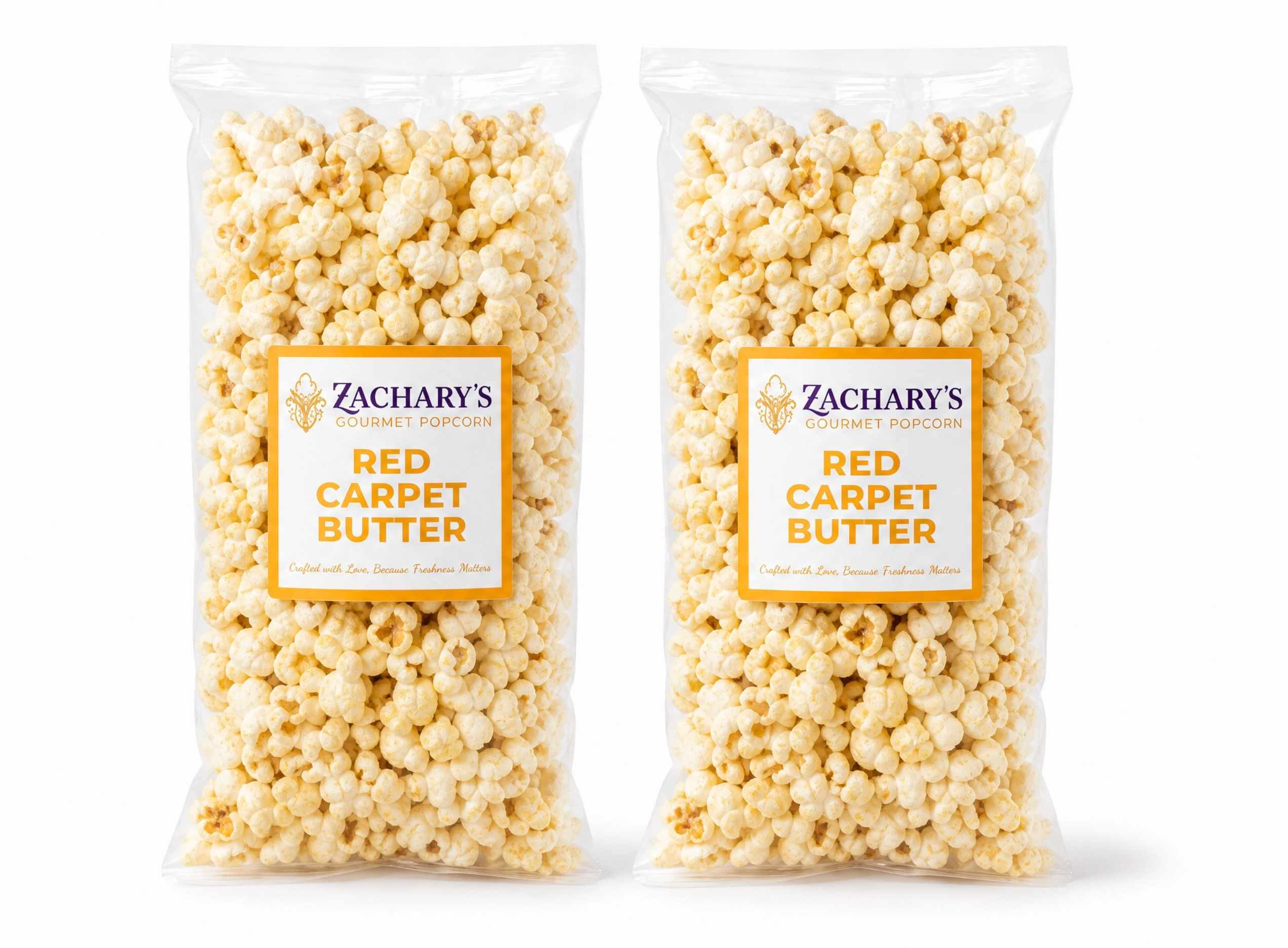 Two bags of Zachary's Red Carpet Butter gourmet popcorn, classic golden buttery kernels with gold and white label